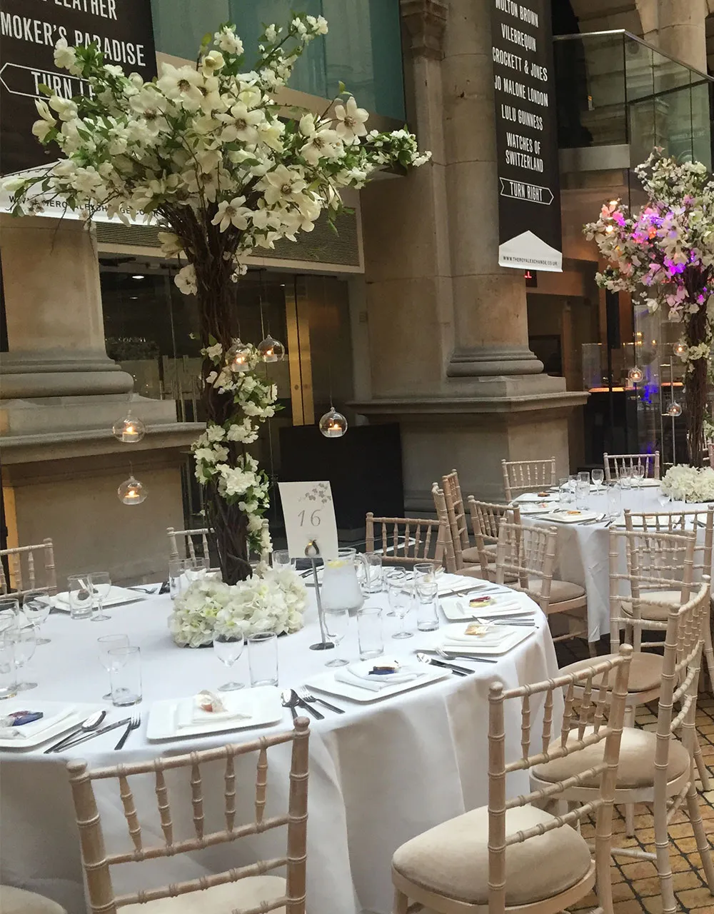 Wedding tables beneath a blossom tree