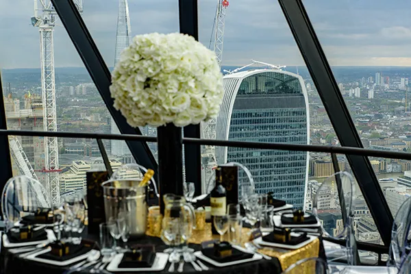 A dinner table high above the City of London