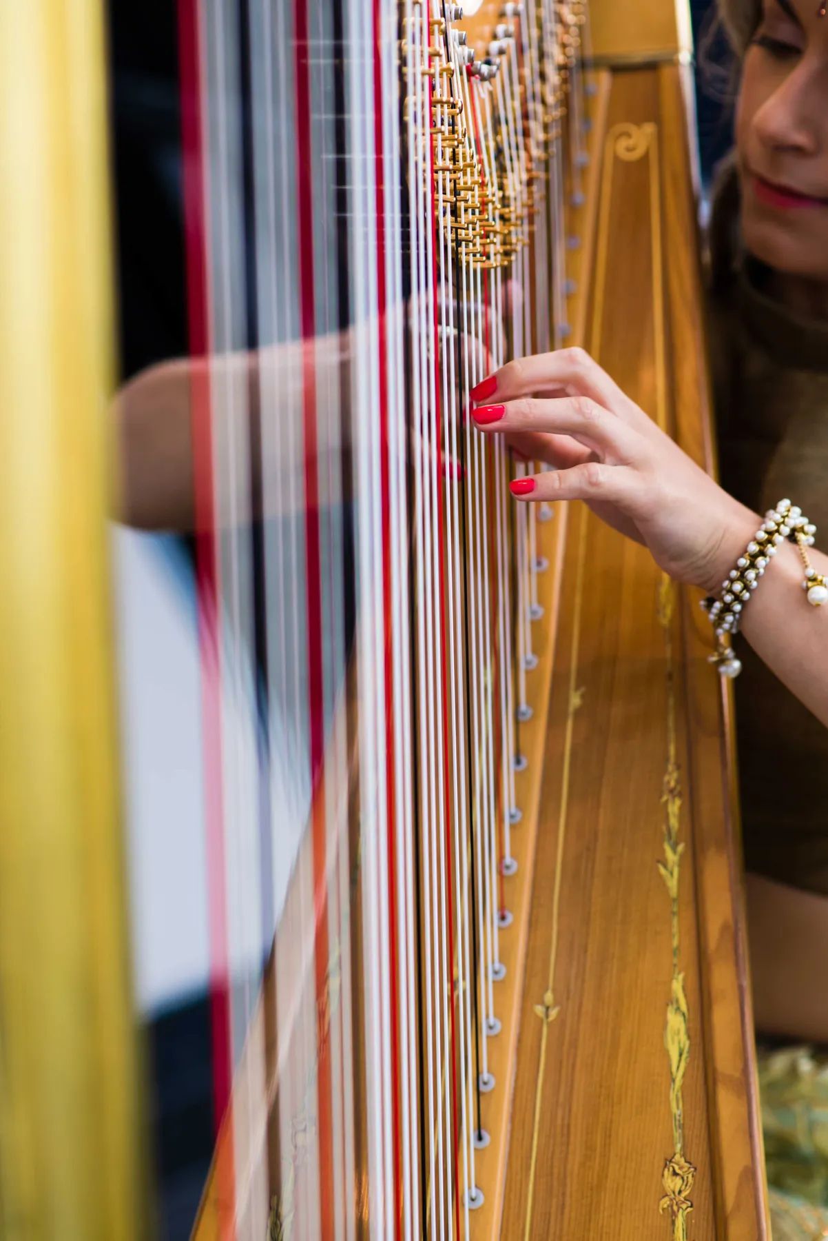A harpist plays at a reception